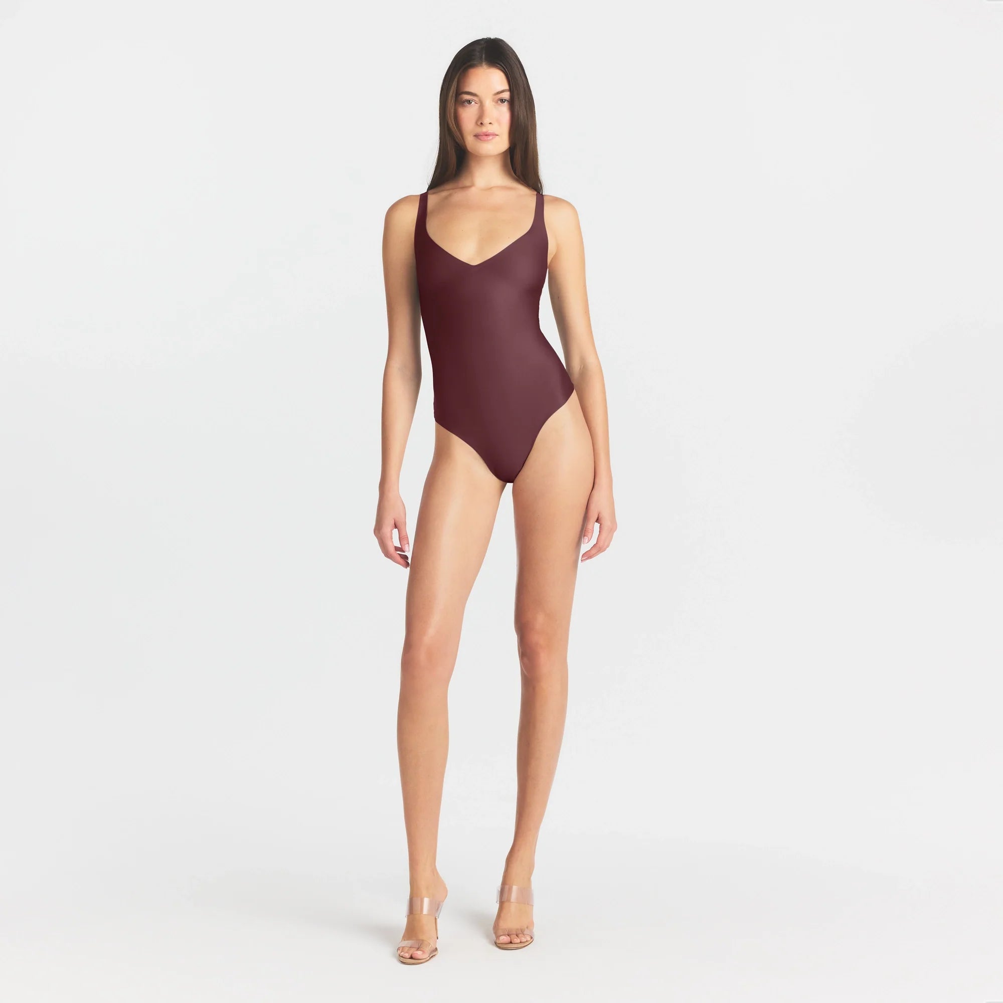 SKIMS BODY UNLINED PLUNGE THONG BODYSUIT | CURRANT